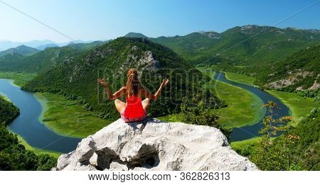 woman sitting on the rock- Lake Skadar in Montenegro