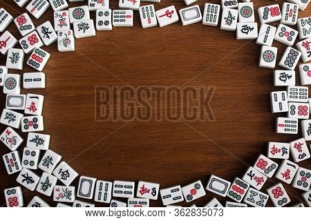 Kyiv, Ukraine - January 30, 2019: Frame Of White Mahjong Game Tiles On Wooden Table, Top View