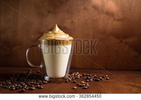 Cold Dalgon Coffee In Clear Glasses On A Dark Wooden Background. Foam From Sugar And Instant Coffee 