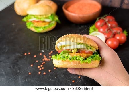 Vegan Burger With Lentil Cutlets . Vegan Food With Vegetable Protein, Herbs, Tomatoes, Onions On A D