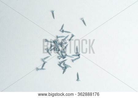 Metal Screws 16 Mm Long Bolts For Furniture On A White Background