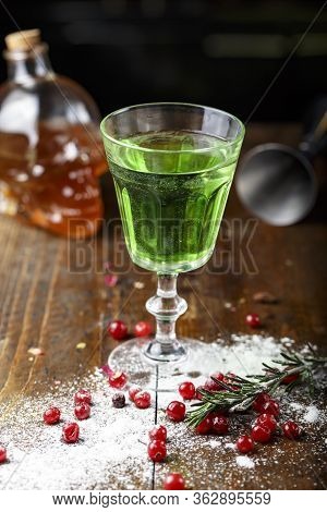 Absinthe Is Poured Into A Beautiful Old Glass, Stands On The Bar Counter. Sugar Is Beautifully Sprin