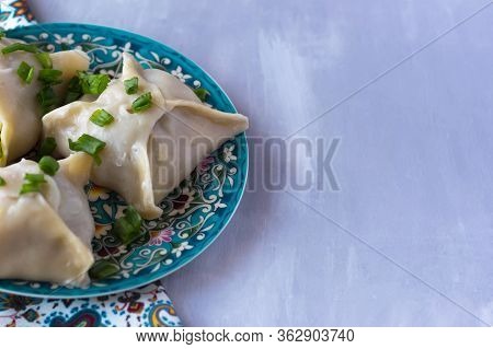 National Cuisine - Uzbek Manti With Meat In A Plate With A Traditional Pattern On The Table. Dastark