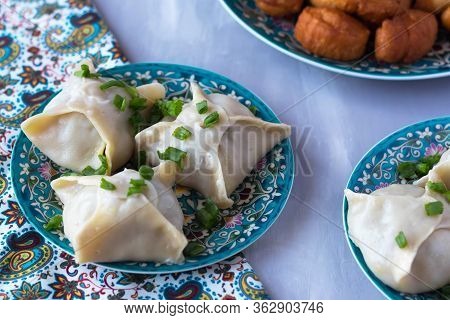National Cuisine - Uzbek Manti With Meat In A Plate With A Traditional Pattern On The Table. Dastark