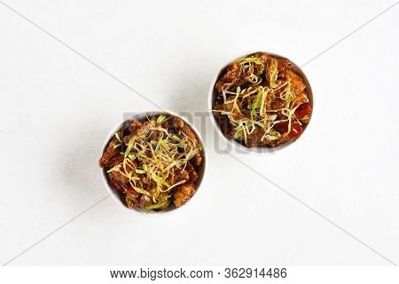 Spicy Garlic Fried Chicken (kkanpunggi). Asian Chicken In Sweet And Sour Sauce In Bowl Over White Ba