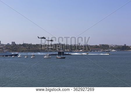 Sevastopol, Crimea, Russia - July 28, 2019: Mi-28 Attack Helicopters Fly By At The Parade In Honor O