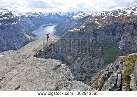 Trolltunga, Norway - July 16, 2015: Tourist Visits Awesome Troll's Tongue (trolltunga) Rock In Horda