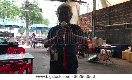 Ko Chang, Thailand - April 9, 2018: Man Playing Flute At A Cheap Thay Restaurant Terrace