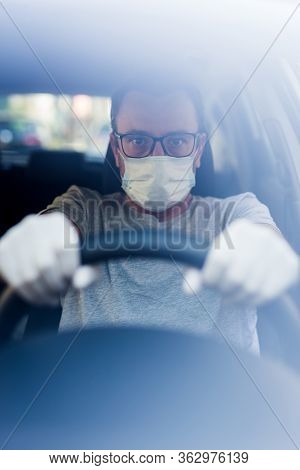Portrait Of Driver With Face Mask And Medical Gloves, Coronavirus Pandemic Concept.