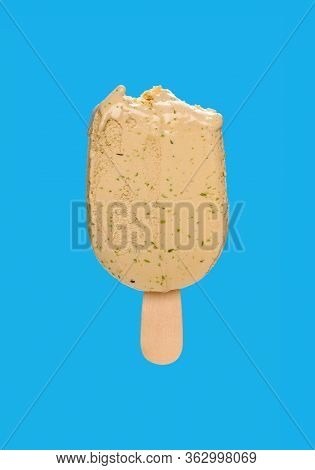Matcha Popsicle With Couple Of Bites On A Blue Background