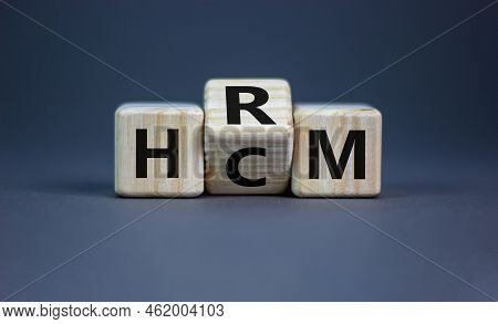 Human Resource And Capital Management Symbol. Turned Wooden Cubes And Changed The Word Hcm To Hrm. B