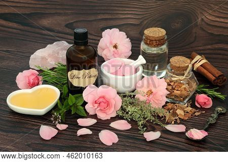 Romantic Love Potion Magic Spell And Aphrodisiac Ingredients With Herbs, Rose Flowers, Honey, Spring