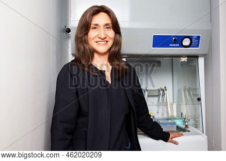 Portrait Of A Female Scientist Next To The Laminar Air Flow Cabinet In The Laboratory.