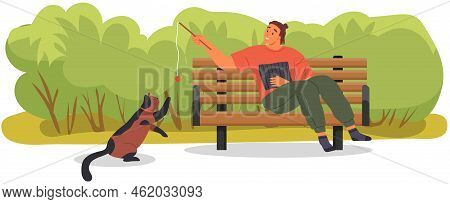 Male Pet Owner With Cat Training, Playing With Ball. Caring For Four-footed Friend Concept. Happy Gu