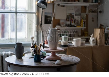 Clay Vase Dries Up Standing On Wooden Rack. Masterpiece Prepared For Making Sketch And Painting Stan