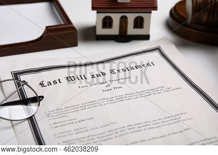 Last Will And Testament Near House Model, Glasses On White Table, Closeup