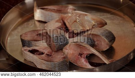 Raw Steakes Of Hilsa Also Known As Tenualosa Ilisha Kept On A Steel Plate