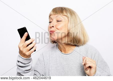 Portrait Of Old Woman Taking Making Selfie Spending Free Time