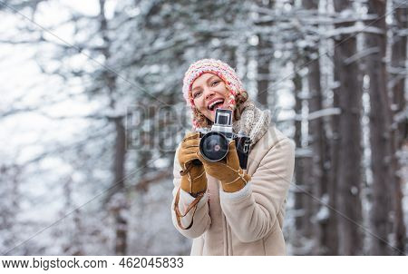 Spend Day Outdoors. Girl With Vintage Camera In Snowy Nature. Traveling Concept. Capturing Winter. T