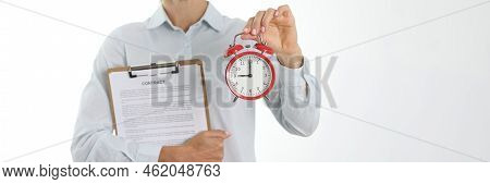 Businesswoman Holding Contract And Alarm Clock. Time To Conclude Business Contract Concept