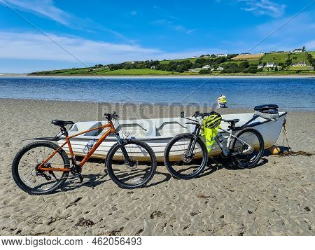 Concept Of Enjoying The Outdoors By Bicycle And Boat At Gweebarra Bay , County Donegal - Ireland