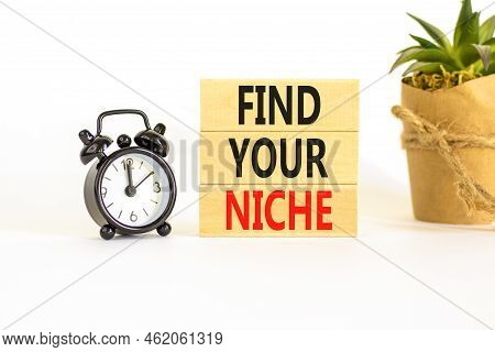 Find Your Niche Symbol. Concept Words Find Your Niche On Wooden Blocks. Black Alarm Clock. Beautiful
