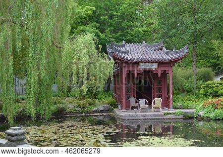 Haren, Netherlands - May 23, 2022: Beautiful View Of Oriental Gazebo Near Pond In Chinese Garden