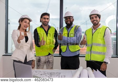 Team Engineers With Draft Plan Of Building On Constructing Site. Engineer Work On Site. Engineer Vis