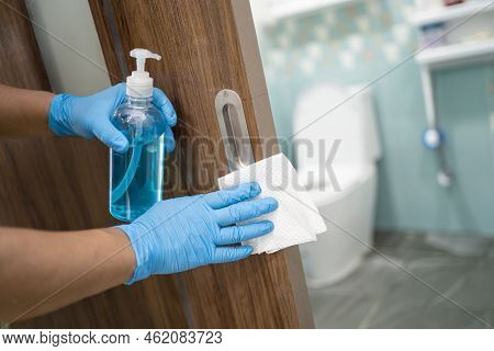 Cleaning Door Toliet Handle At Toilet With Alcohol And Tissue At Office And Home For Protect Covid 1