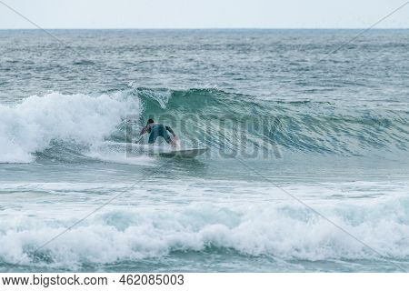 Local Surfer Riding Waves