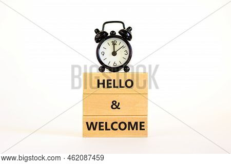 Hello And Welcome Symbol. Concept Words Hello And Welcome On Wooden Blocks. Beautiful White Backgrou