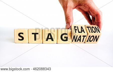 Stagflation Or Stagnation Symbol. Businessman Turns Cubes, Changes The Word Stagnation To Stagflatio