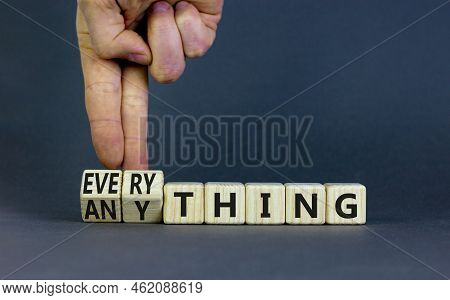 Anything Or Everything Symbol. Businessman Turns Cubes And Changes The Concept Word Anything To Ever
