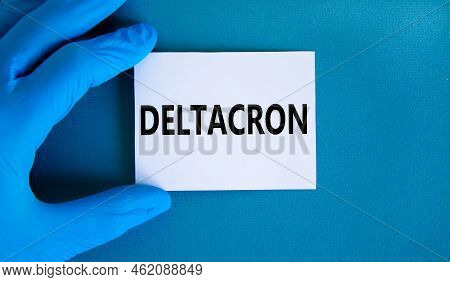 Covid-19 Corona Deltacron Variant Symbol. Hand In Blue Glove With White Card. The Concept Word Delta