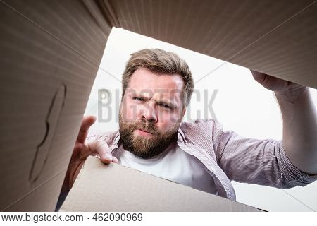 Man Unpacked The Delivered Box With The Parcel, He Frowns And Gets Angry, They Brought Him Not What 