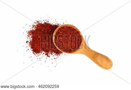 Close Up One Wooden Scoop Spoon Full Of Ground Sundried Tomatoes, Heap Of Powder Spilled Around, Iso