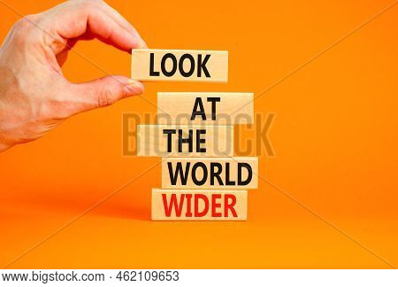 Look At The World Wider Symbol. Concept Words Look At The World Wider On Wooden Blocks On A Beautifu