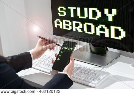 Sign Displaying Study Abroad. Word For Pursuing Educational Opportunities In A Foreign Country