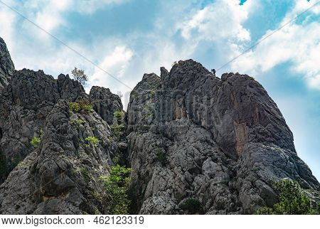 Paklenica, Croatia, Eu - June 25, 2022: Distant View Of Mountain Climber In National Park Paklenica.