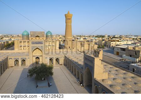 Bukhara, Uzbekistan - September 09, 2022: Sunny Day Over The Ancient Poi-kalan Mosque