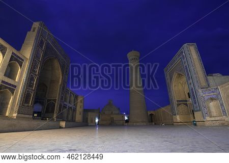 Bukhara, Uzbekistan - September 10, 2022: Night At The Ancient Kalan Madrasah And Mir-i-arab Madrasa