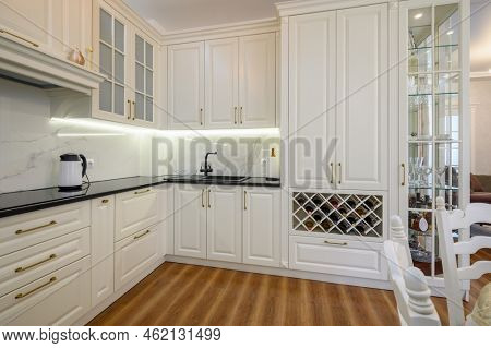 White luxiry modern classic kitchen furniture with wine rack, corner view