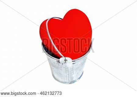 Large Red Heart Kept In A Bucket Isolated On White Background. Healing A Broken Heart.