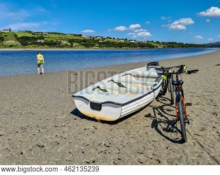 Concept Of Enjoying The Outdoors By Bicycle And Boat At Gweebarra Bay , County Donegal - Ireland