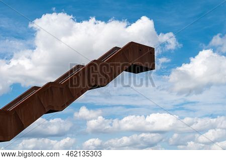 Tielt-winge, Flemish Brabant, Belgium,  08 22 2022 - Observation Stairs And Tower Against Blue Sky