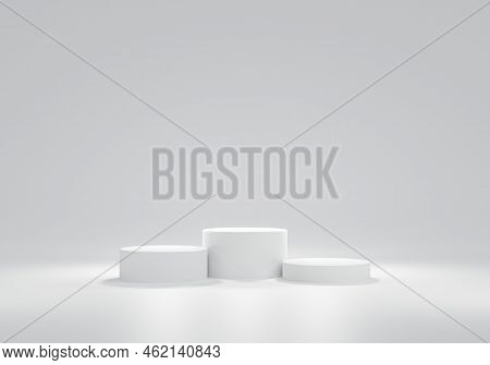 Three White Circular Podium Arranged Next To Each Other On White Background.