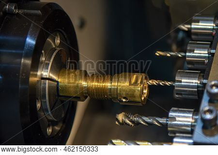 The Multi-tasking Cnc Lathe Machine Swiss Type Tapping The Brass Shaft Parts. The High Technology Me