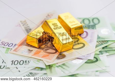 Euro Banknotes And Gold Ingots Close Up