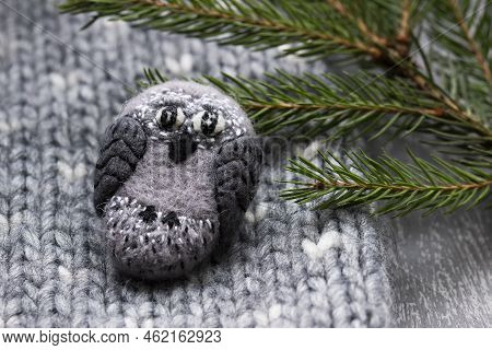 Handmade Wool Brooch On A Sweater Background. Selective Focus.