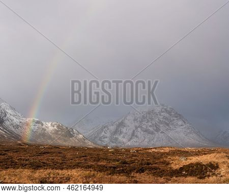 Stunning Landscape Image Of Vibrant Rainbow In Front Of Mountains In Scottish Highlands Rannoch Moor